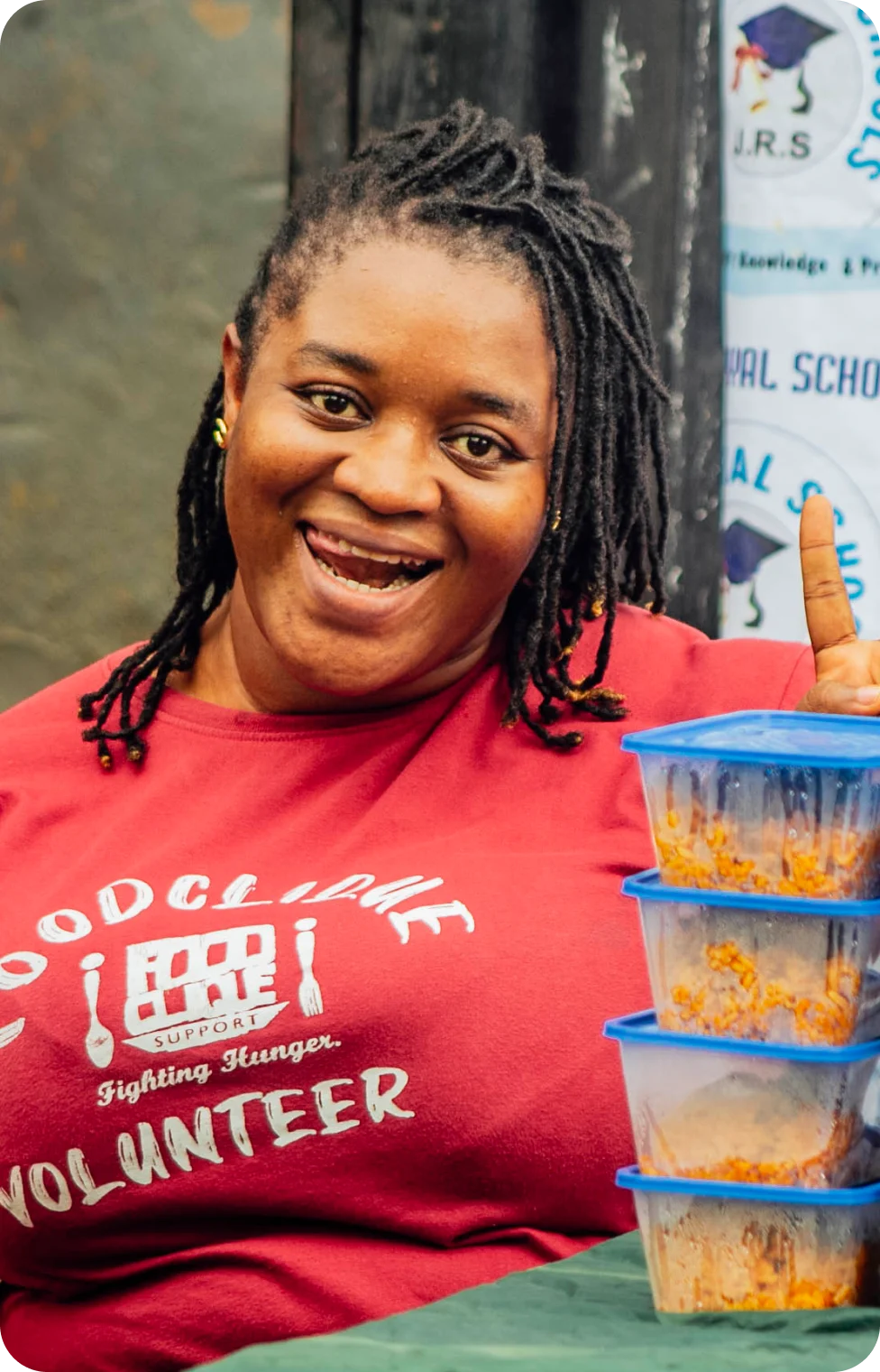 a lady in red tshirt smiling